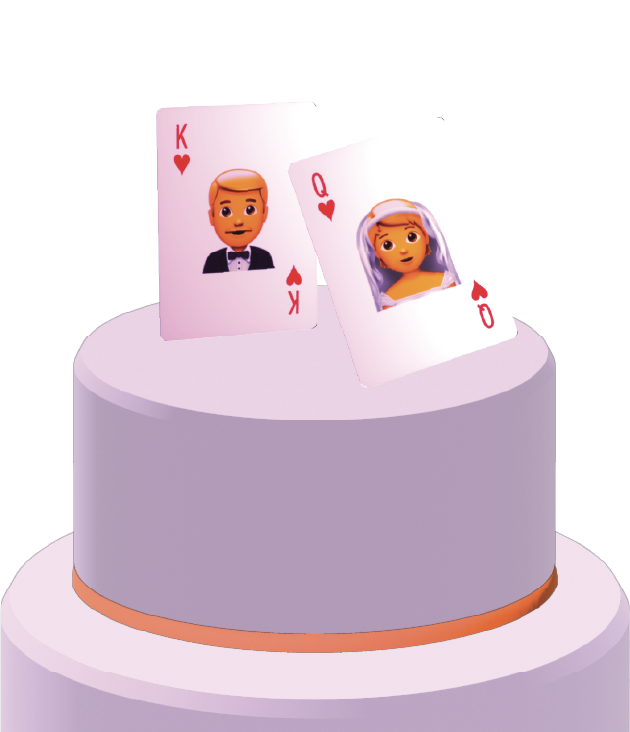 A cake with two playing cards on top: one emoji groom and one emoji bride.